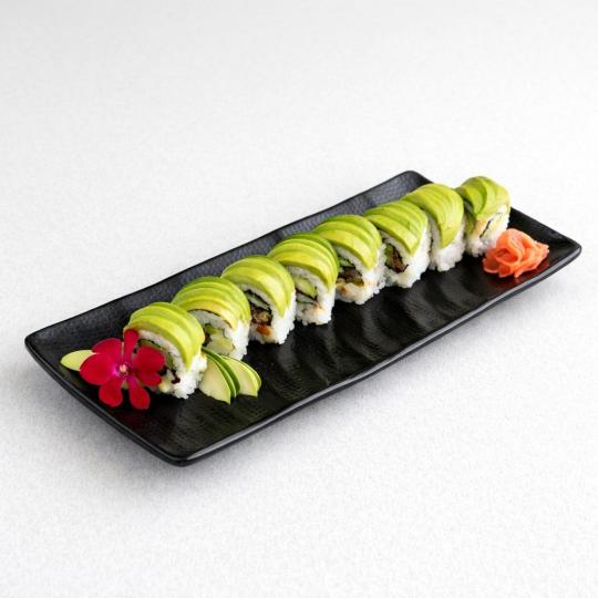 Green dragon roll topped with avocado